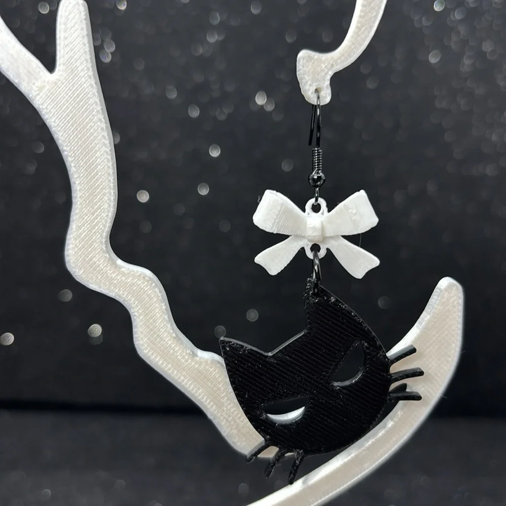 The Spooky Paws Earrings with White Bows